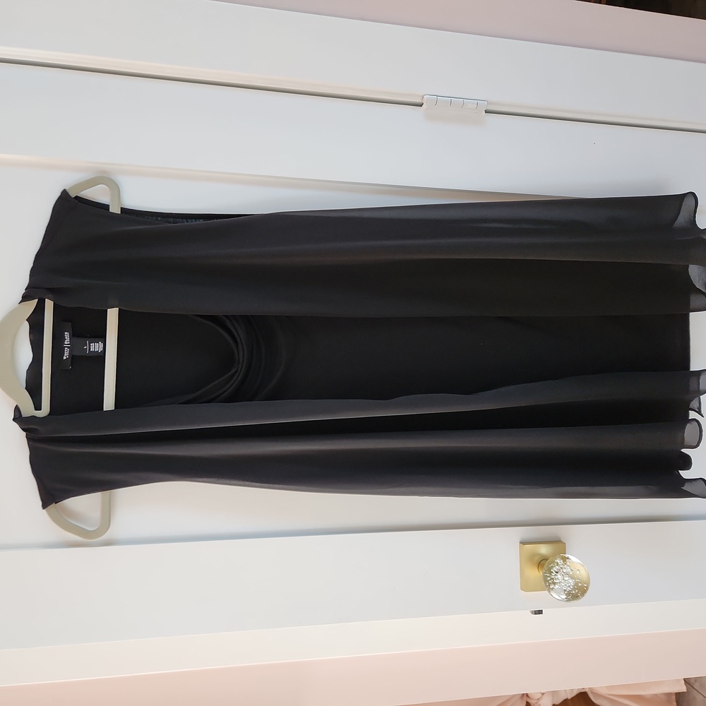 WHBM long, flowy, and sleeveless tunic blouse made of black tencel and crepe